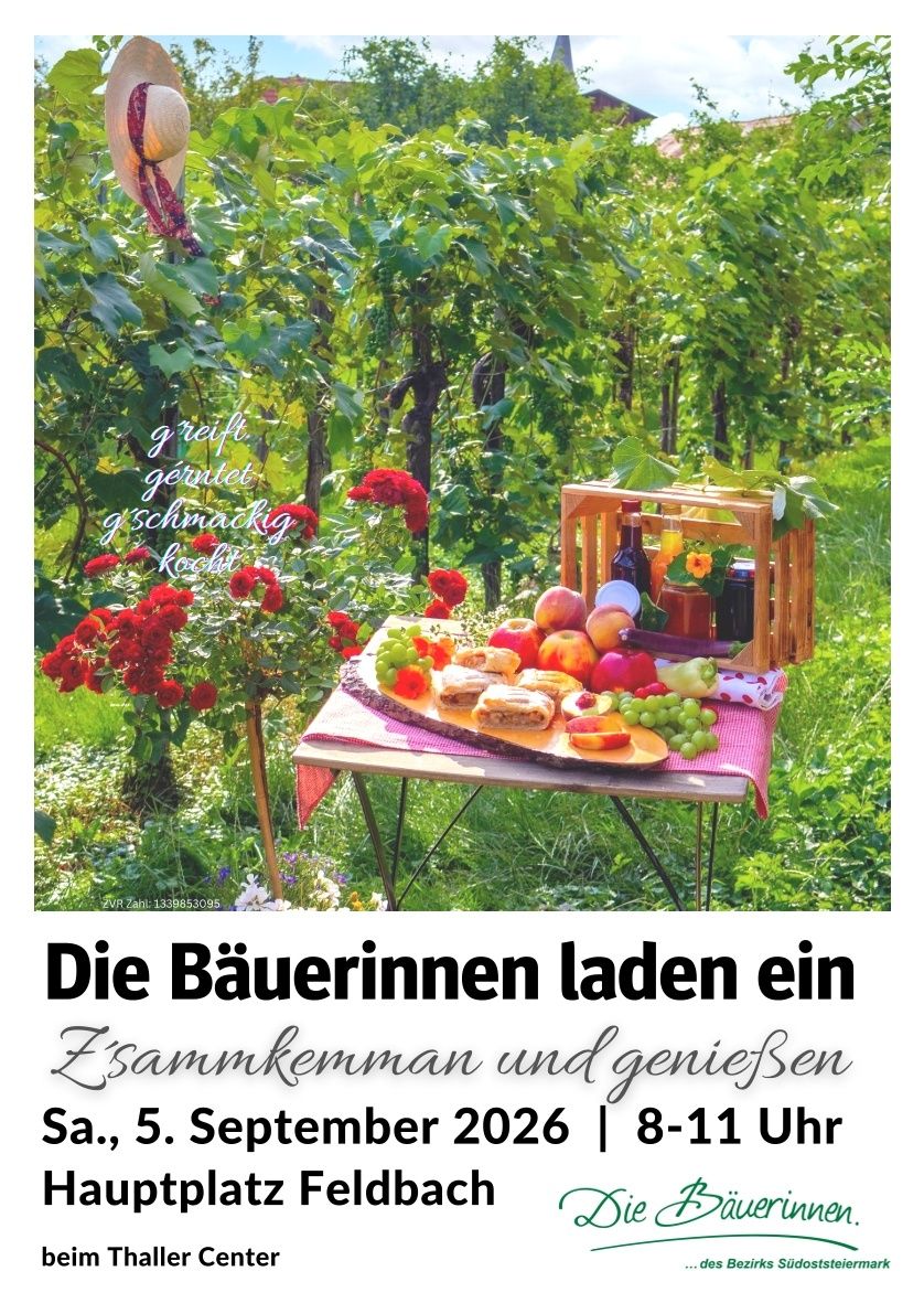 A table set with a variety of fruits, sandwiches, and a bottle of wine in a garden setting with red flowers and green foliage. The image has a watermark with the text 'Die Bäuerinnen laden ein Zusammenkommen und genießen'.