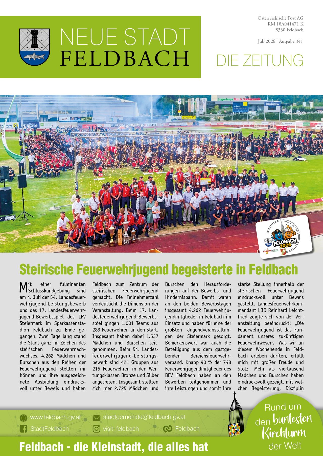 A large group of people, possibly firefighters, are gathered on a field with a banner and a podium. They are wearing uniforms and holding trophies. A crowd of people is watching them from the sidelines. The image has a watermark in the bottom right corner.