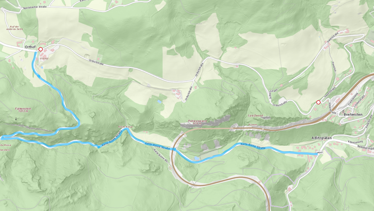 A topographical map shows a winding river with a bridge, surrounded by green hills. Roads and paths crisscross the area, with named locations like Pollereswand, Klamm, and Spiewand.