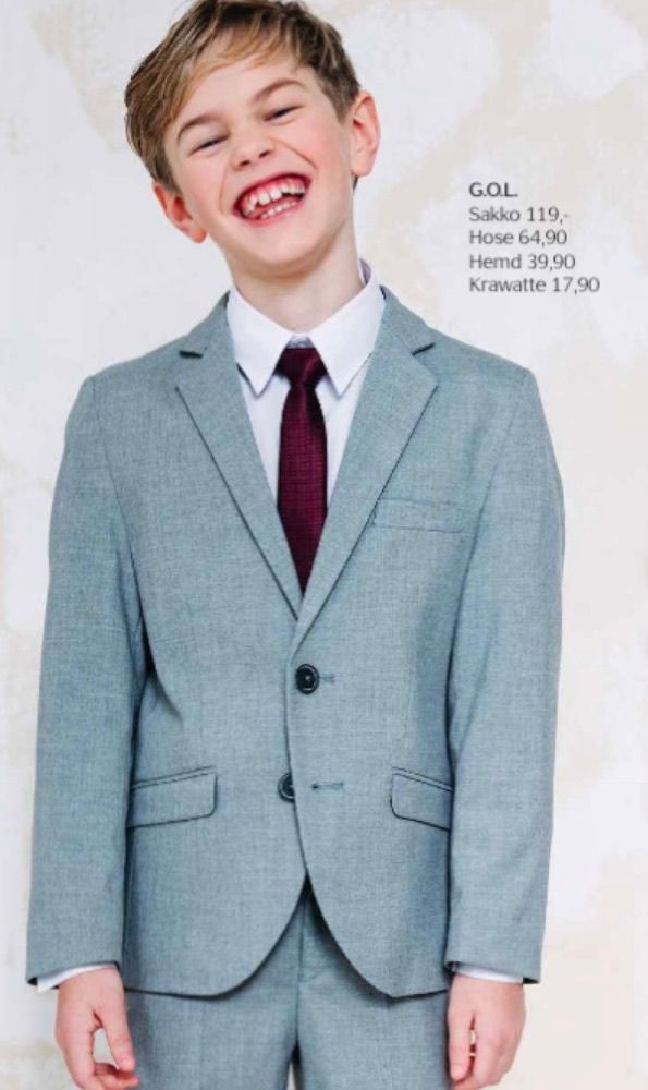 Bild enthält, Formal Wear, Suit, Blazer, Coat, Jacket, Head, Person, Tie, Face, Happy