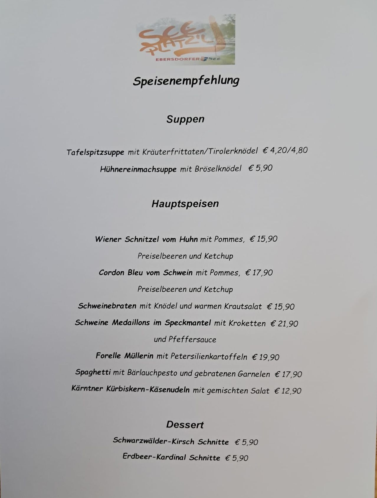 Menu recommendation: Soups include Tablespoon soup with herb dumplings/Tirolerknodel at €4,20/4,80 and chicken noodle soup with broselkanodel at €5,90. Main courses include Wiener Schnitzel with chicken, €15,90, Cordon Bleu with chicken, €17,90, pork chops with noodles and warm herb salad, €15,90, and pork medallions with bacon and pepper sauce, €21,90. Desserts include Forelle Müllerin with parsley potatoes, €19,90.