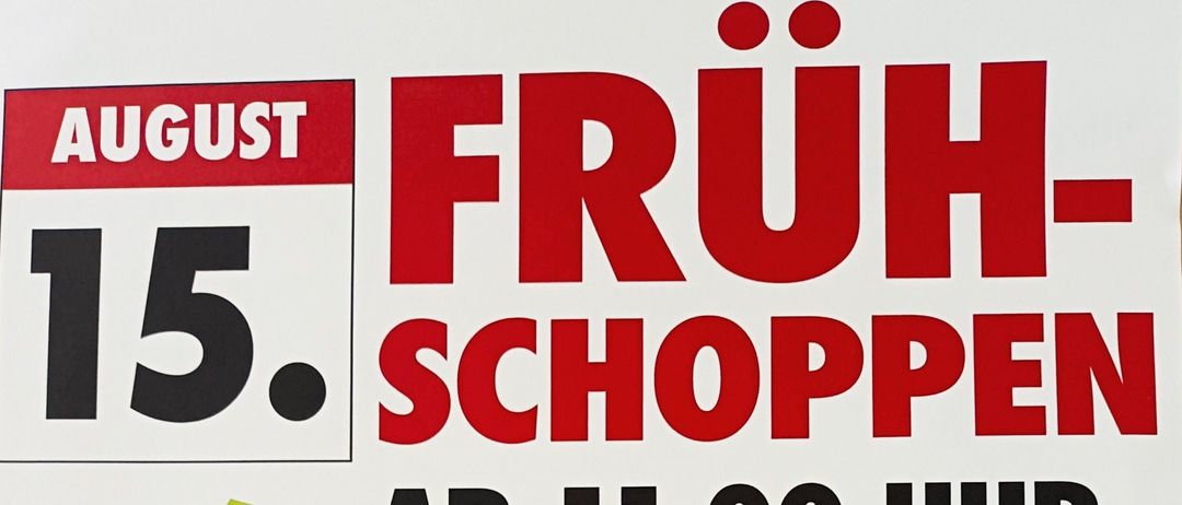 Ein Plakat bewirbt Einkäufe in Bad Loipersdorf mit Live-Musik von Urig 2 ab 11:00 Uhr. Die Veranstaltung kann bei schlechtem Wetter abgesagt werden.