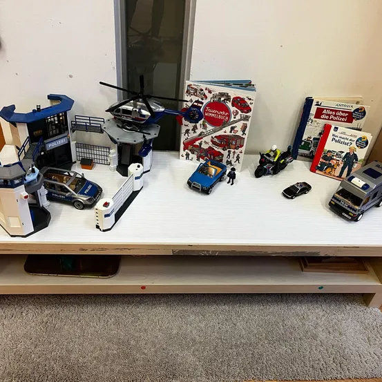 Furniture, Table, Helicopter, Transportation, Vehicle, Toy, Motorcycle, Person, Lego Set, Desk