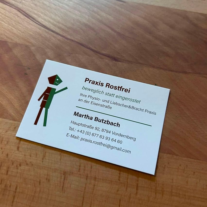 A white business card with a green illustration of a person and the text 'Praxis Rostfrei'. It includes the name 'Martha Butzbach', a phone number, and an email address.