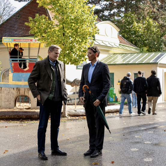 Image contains, Coat, Person, Walking, Jacket, Suit, Pants, Blazer, Adult, Male, Man