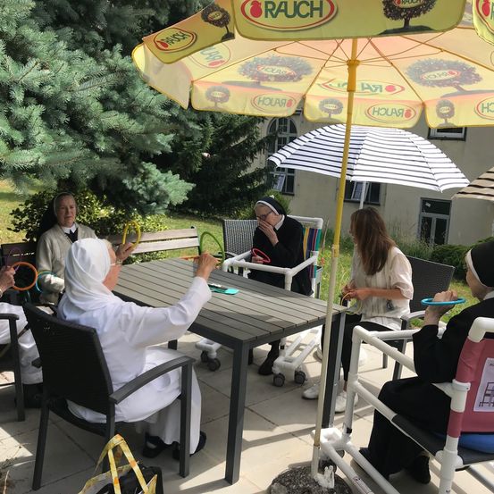 Image contains, Dining Table, Table, Adult, Female, Person, Woman, Patio, Chair, Restaurant, Tree