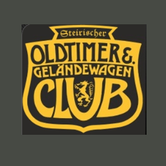 Das Logo für Oldtimers und Geländewagen Club ist auf einem schwarzen Hintergrund dargestellt. Das Logo zeigt einen Schild mit einem Löwenkopf und den Worten 'Oldtimers Geländewagen Club' in Gelb.