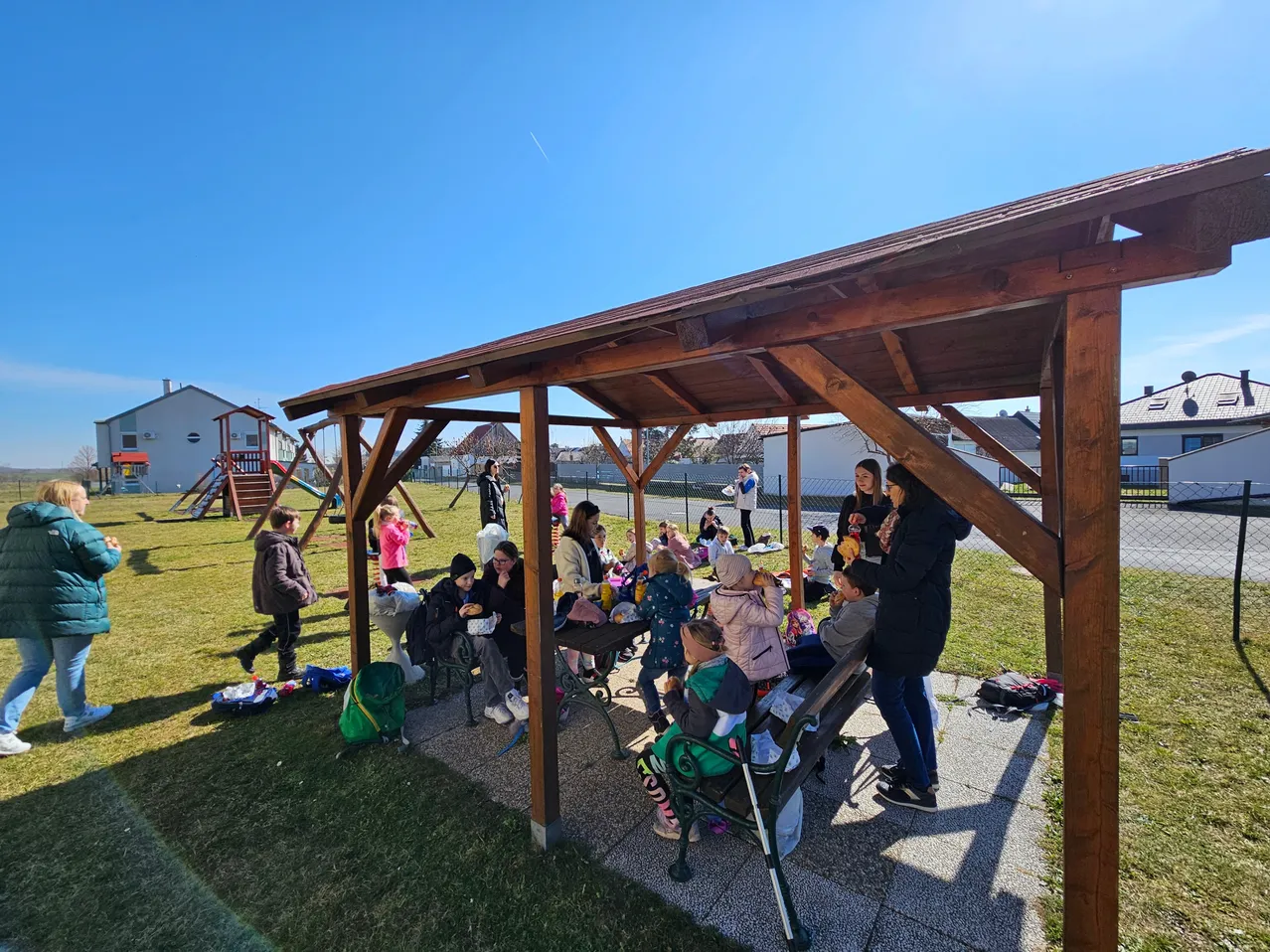 Housing, Porch, Outdoors, Shelter, Patio, Pergola, Person, Coat, Jacket, Wood