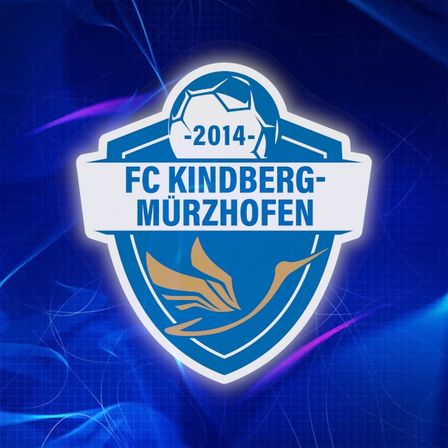 Das Logo des FC Kindberg Murzhofen zeigt einen blauen Schild mit einer goldenen Flamme vor einem blauen Hintergrund. Der Verein wurde 2014 gegründet.