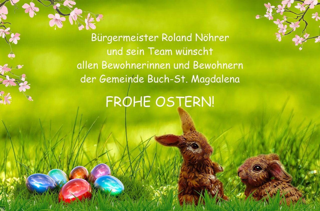 Zwei Hasen mit bunten Eiern auf einem grünen Feld. Bürgermeister Roland Nohrer und sein Team wünschen allen Bewohnern ein frohes Osterfest.