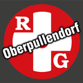 Roter runder Logo mit einem weißen Kreuz und dem Wort 'Oberpullendorf' in weiß auf rotem Hintergrund. Unter dem Kreuz steht der Buchstabe 'G'.