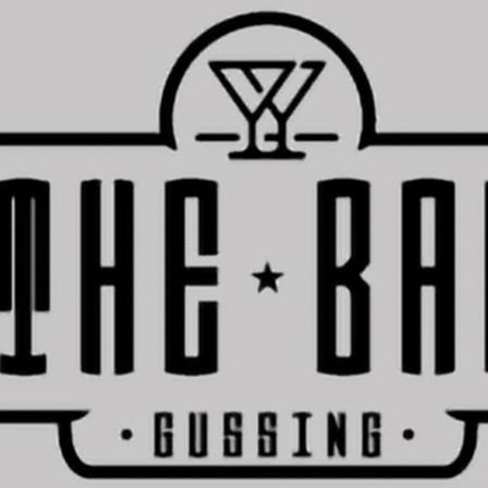 Das Logo von The Bar Gussing zeigt einen Stern in einem Cocktailglas. Der Text 'THE BAR' ist fett und zentriert, mit 'Gussing' darunter in kleinerer Schrift. Das Design ist minimalistisch und elegant.