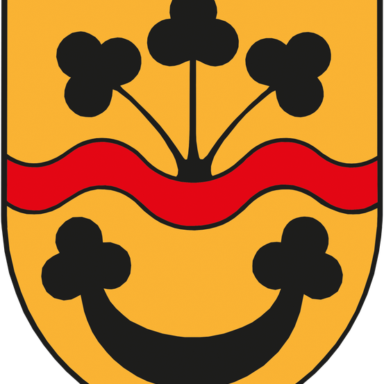 Ein gelber Schild zeigt drei schwarze Kleeblätter über einer roten Wellenlinie und einem schwarzen lächelnden Gesicht darunter.