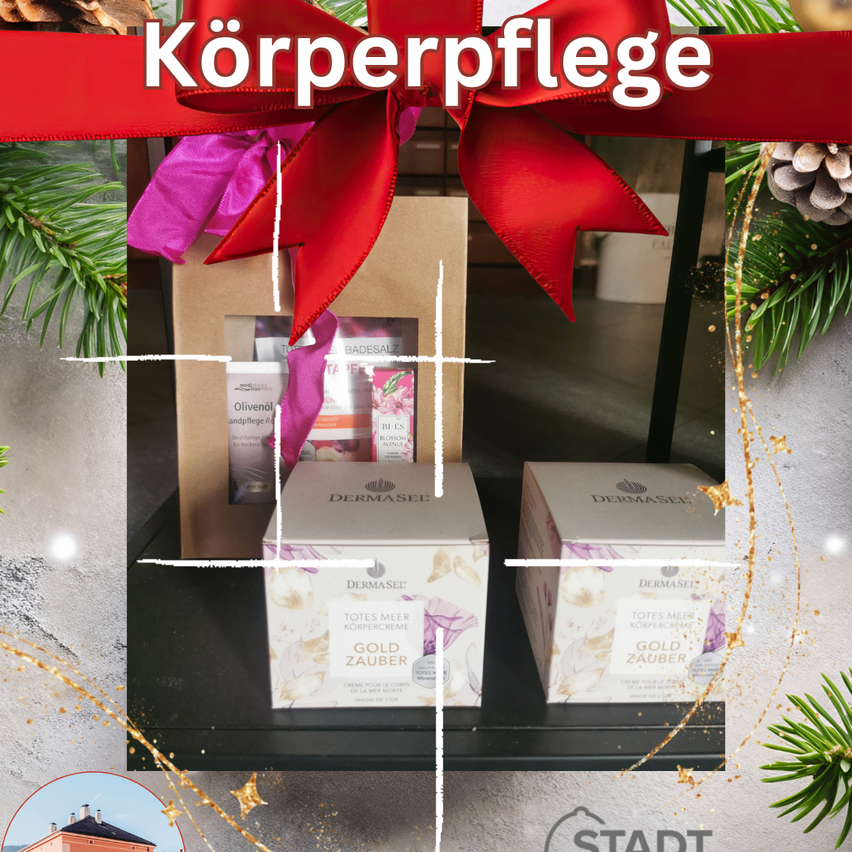 Ein Geschenkset für Körperpflege mit einem roten Band, bestehend aus zwei Schachteln 'Totes Meer Gold Zauber' Creme, auf einer dunklen Oberfläche platziert.