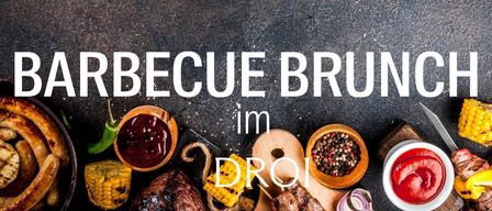 Barbecue spread on a rustic surface with various meats, corn, and sauces. The text reads 'Barbecue Brunch im Droi'.