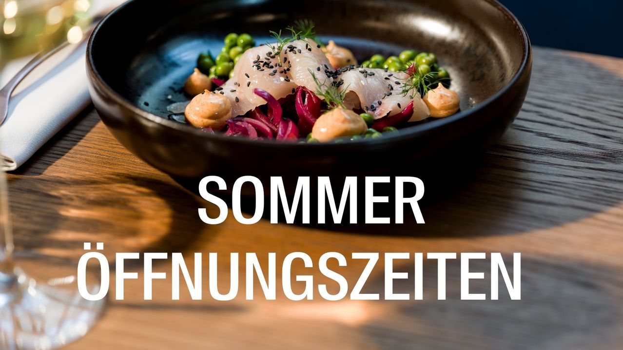A black bowl filled with a dish of fish, green peas, and red cabbage, with a text overlay reading 'SUMMER EROEFFNUNGSZEIT'.