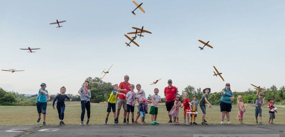 Airport, People, Person, Clothing, Shorts, Airfield, Aircraft, Airplane, Vehicle, Walking