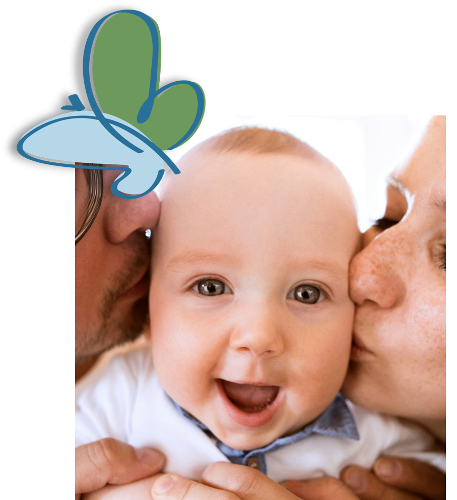 A smiling baby with a blue collar looks at the camera. Two adults, a man and a woman, kiss the baby's cheeks. The baby has light brown eyes and light skin.