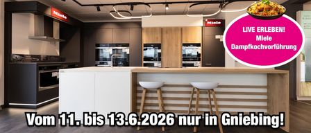 Modern kitchen with white counter and bar stools, equipped with ovens and cabinets, featuring Miele branding and an announcement until 13.6.2026.