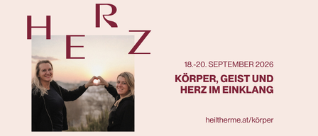 Zwei lächelnde Frauen bei Sonnenuntergang, eine macht ein Herz. Veranstaltung vom 18.-20. September 2026, Veranstaltungsname 'Körper, Geist und Herz im Einklang'. Webseite: heiltherme.at/korper.