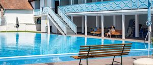 Image contains, Pool, Water, Bench, Hotel, Resort, Swimming Pool, Chair, Person, Villa, Outdoors