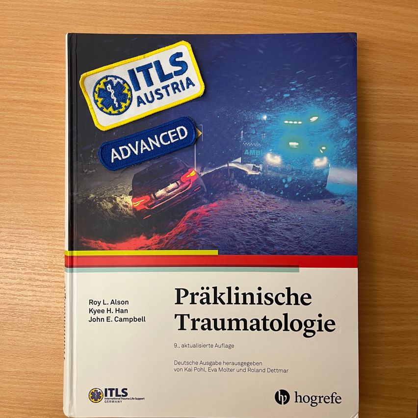 Book titled 'Praklinische Traumatologie' by authors Roy L. Alson, Kyee H. Han, and John E. Campbell. The cover features a snowy scene with vehicles and patches.