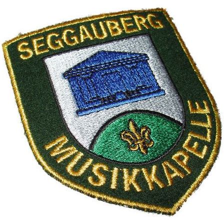 Bild enthält, Badge, Logo, Symbol