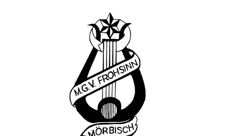 Das Bild zeigt das Logo für MGV Frohsinn Morbisch, mit einer Leier und Harfe, gekrönt von einem Stern, umwickelt von einem Band mit den Aufschriften 'M.G.V. Frohsinn' und 'Morbisch'.