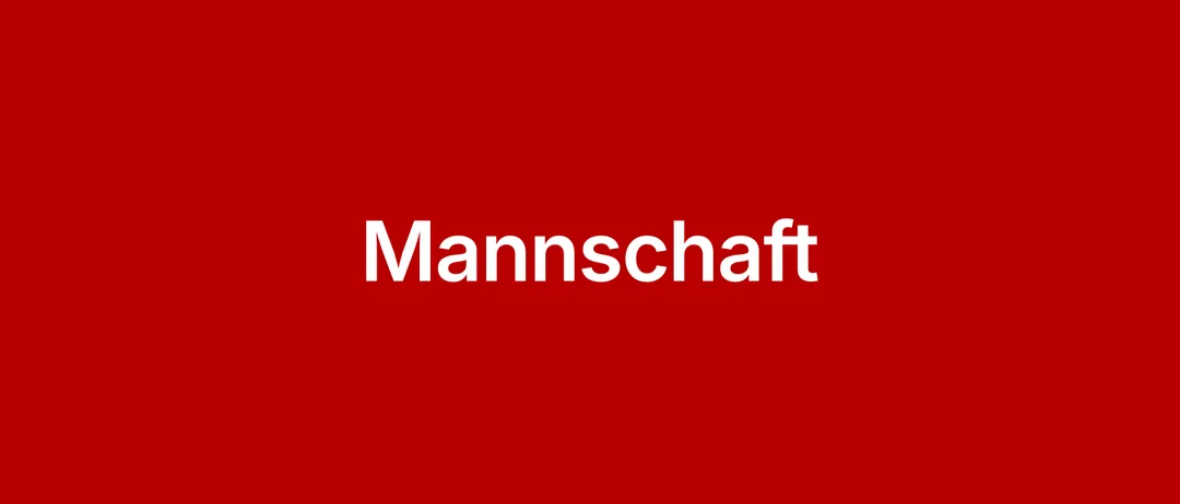 Ein roter Hintergrund mit weißem Text, der in großen, fetten Buchstaben 'Mannschaft' schreibt.