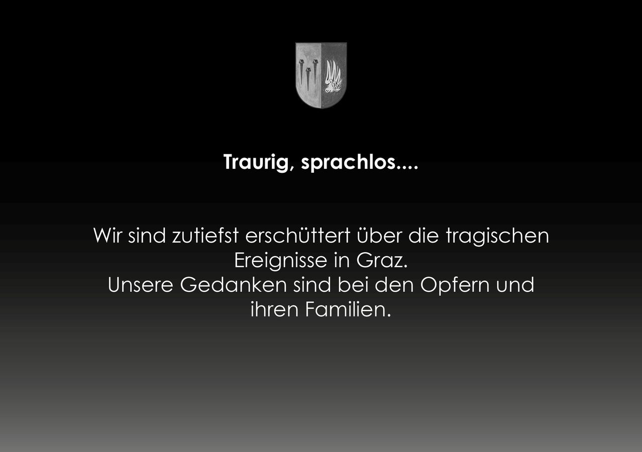 Ein schwarzer Hintergrund mit einem Wappen und Text auf Deutsch. Das Wappen hat drei Spitzen und eine Flamme. Der Text lautet 'Traurig, sprachlos...' und 'Wir sind zutiefst erschüttert über die tragischen Ereignisse in Graz. Unsere Gedanken sind bei den Opfern und ihren Familien.'