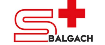 The logo features a stylized letter 'S' with a red cross symbol on the right. The word 'BALGACH' is written below the logo in black.