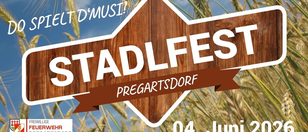 Ein hölzerne Sternform-Schild mit der Aufschrift 'TADLFES PREGARTSDORF'. Es steht vor einem Weizenfeldhintergrund. Das Datum '04. JUN' ist unten rechts.