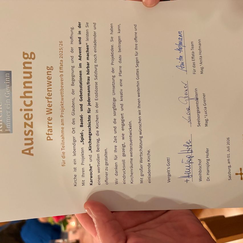 A certificate of recognition is held by a person, dated July 1, 2026, with signatures and printed text in German. It highlights achievements and contributions.