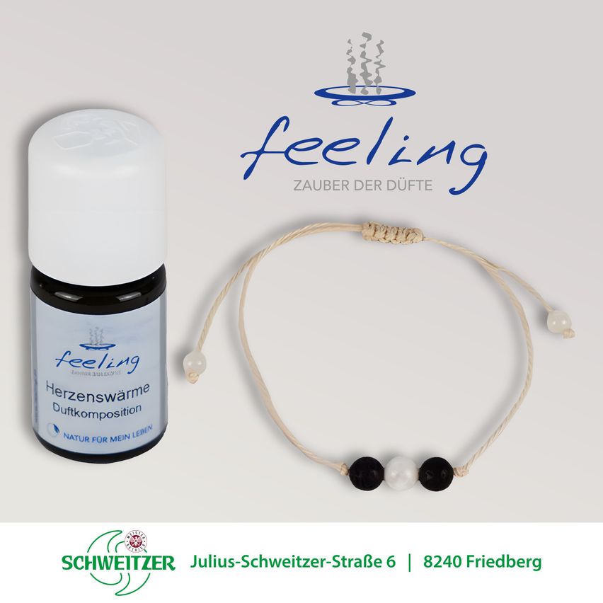 An advertisement for 'feeling' aroma oil shows a bottle with a white cap and a pearl-adorned bracelet. The bottle has a label reading 'Herzenswärme Duftkomposition' and 'Natur für mein Leben'. Below the product, the address Julius-Schweitzer-Straße 6, 8240 Friedberg is displayed.