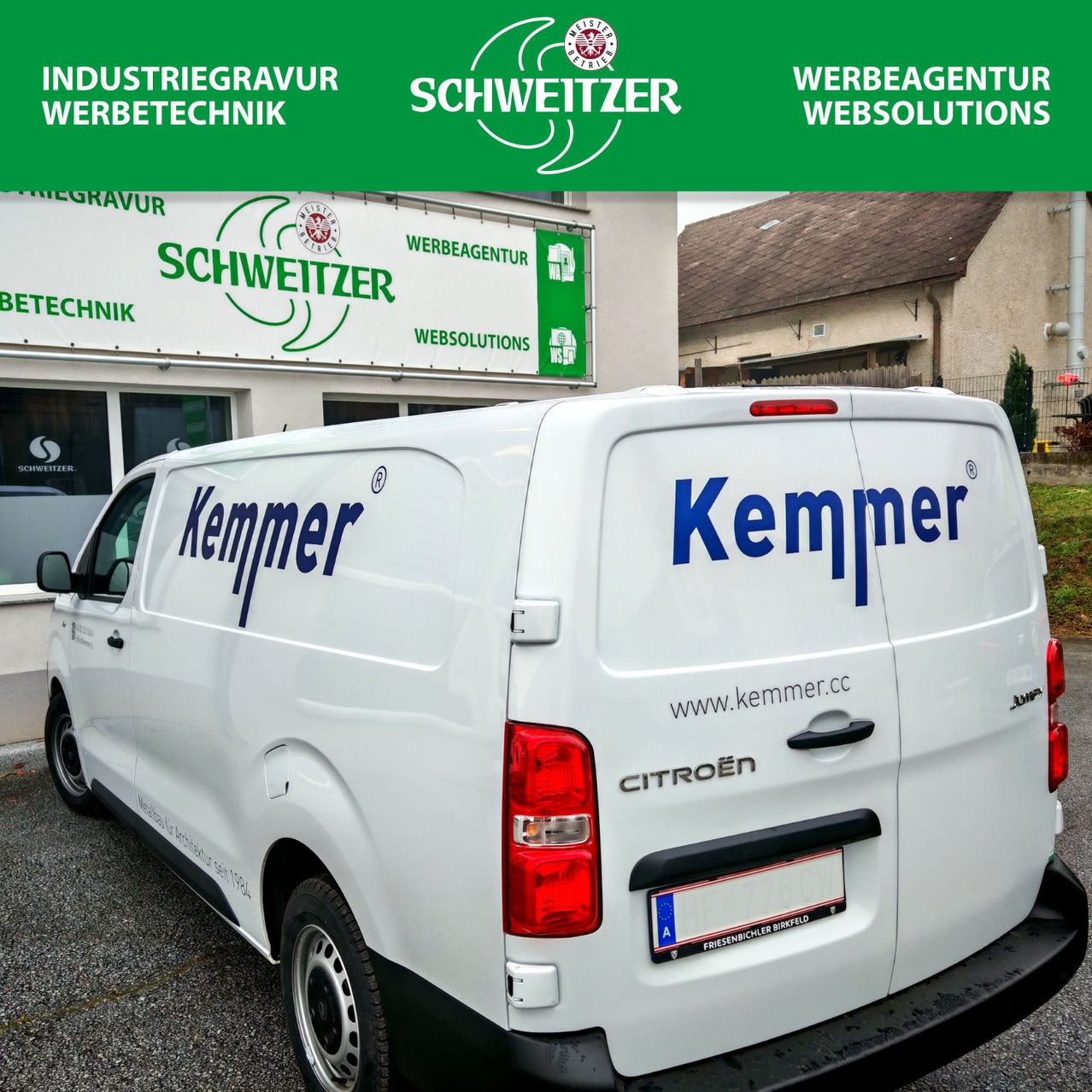 A white van with the word Kemmer written on the side and back. It has a license plate with the letters A and an image of a bicycle.