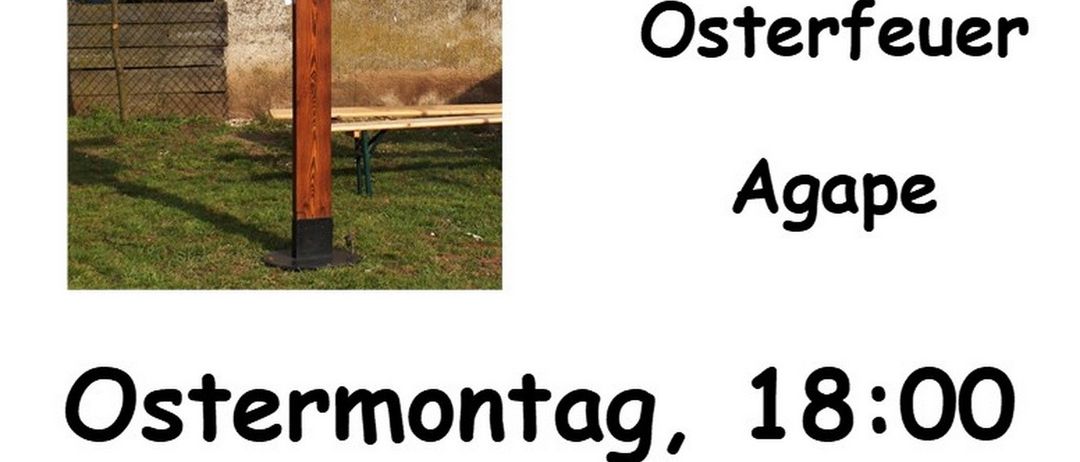 Ein Holzkreuz mit 'Meinen Freunden gebe ich Euch' darauf. Darunter steht 'Auferstandenen begegnen Osterfeuer Agape'. Veranstaltungsdetails: Ostermontag, 18:00 r.k. Pfarrgarten Zurndorf.