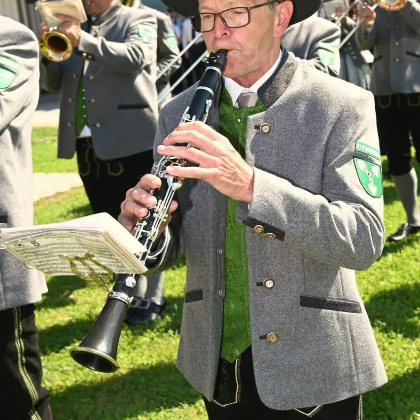 Adult, Male, Man, Person, Clarinet, Musical Instrument, Hat, Coat, Oboe, Face