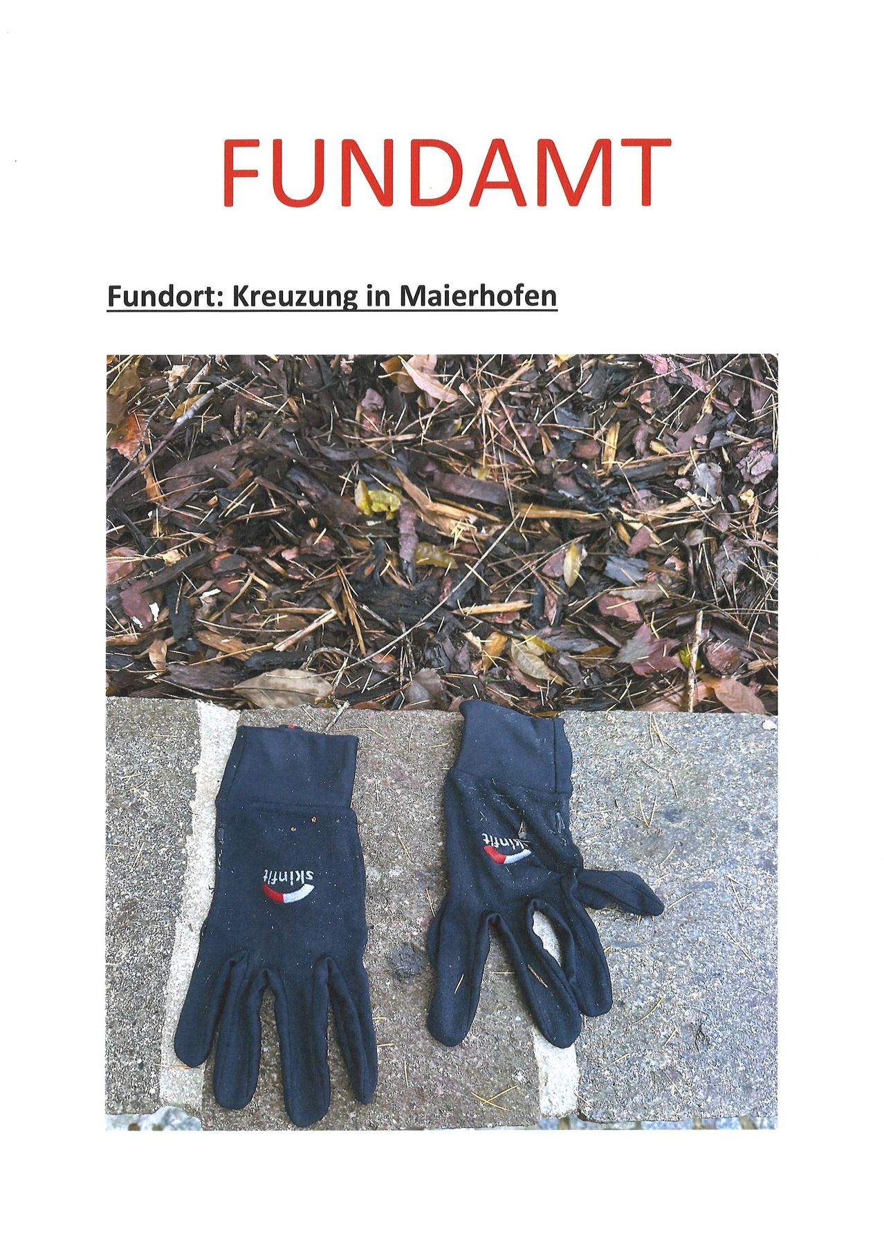 Das Bild zeigt zwei Handschuhe auf einer Betonfläche mit einem Haufen von Mulch im Hintergrund. Die Handschuhe sind schwarz mit weißem Text. Der Text auf den Handschuhen lautet 'Spitz'. Das Bild hat einen Wasserzeichen 'FUNDAMT'.