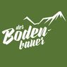 Ein grüner Hintergrund mit weißem Text, der 'der Boden-Laver' lautet. Der Text ist stilisiert mit einer Bergkette darüber.