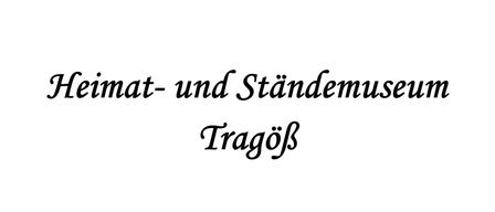 Schwarzer Text auf weißem Hintergrund mit der Schrift 't- und Stände Tragö' in einer stilisierten, fließenden Schriftart.