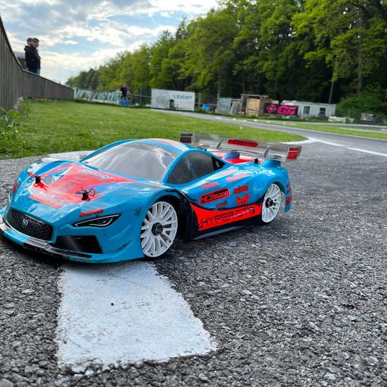 Image contains, Car, Vehicle, Person, Adventure, Auto Racing, Race Car, Wheel, Offroad, Rally, Shoe