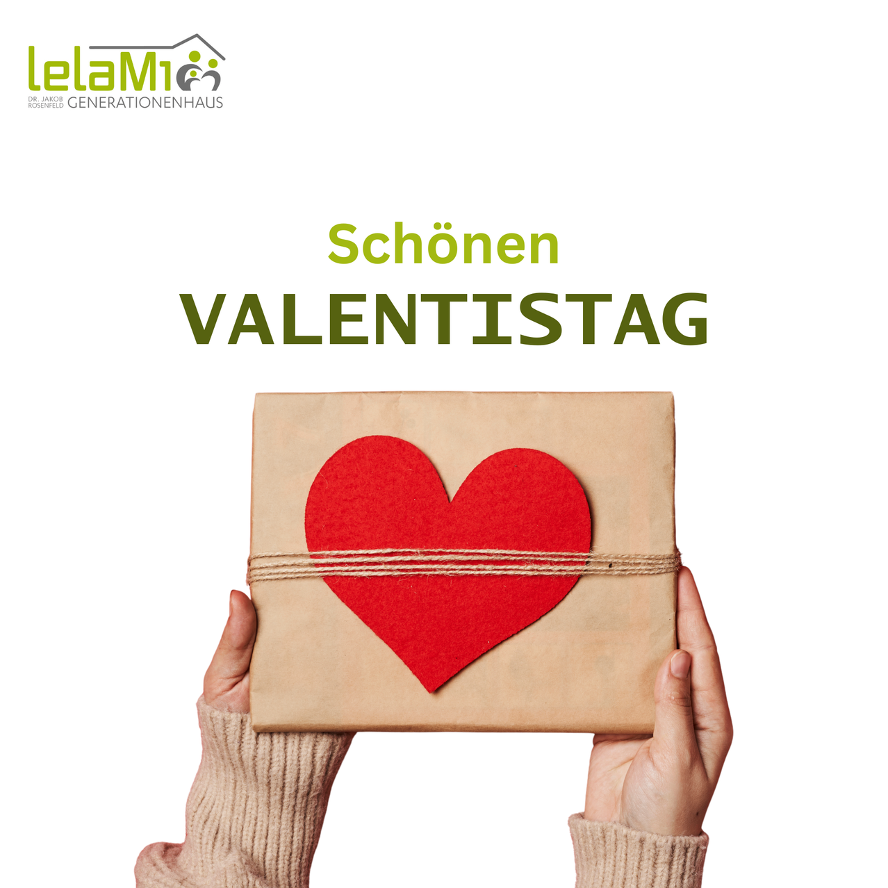 Ein Geschenkkarton mit einem roten Herzband, auf einem weißen Hintergrund präsentiert. Der Karton wird von zwei Händen in Pullovern gehalten. Über dem Karton stehen die Worte 'Schon VALENTISTAGE'.