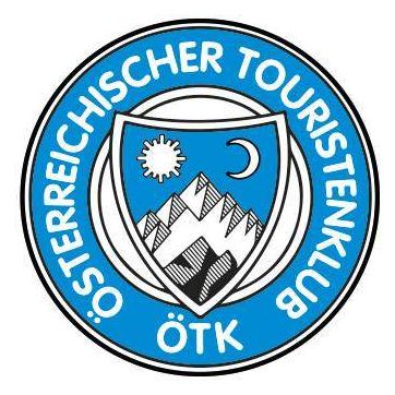 Das kreisförmige Logo zeigt einen Schild mit Bergen, einer Sonne und einem Halbmond. Es ist mit 'Österreichischer Touristenklub ÖTK' in blauem Text gekennzeichnet.