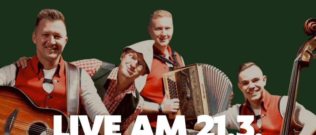 Ein Werbeplakat für ein Live-Musik-Event namens 'Das Experiment' von Ligist 3+1. Vier Männer in traditioneller Kleidung spielen Instrumente. Die Veranstaltung findet am 21. März ab 16 Uhr statt. Tickets kosten 22 Euro pro Stück.