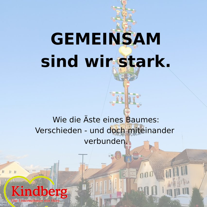 An advertisement for Kindberg, a company with a heart, featuring a tree with a heart and a slogan about unity and strength.