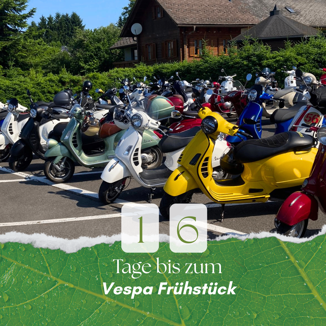 A parking lot full of scooters, yellow, green, and white, parked in a row. A house is behind the scooters. Text reads 1 day until Vespa breakfast.