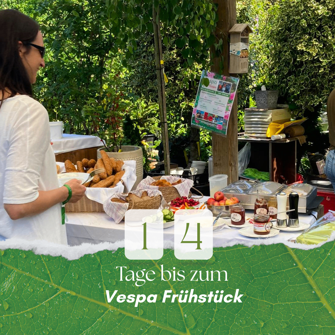 A woman stands behind a table full of food, with a countdown of 14 days until a Vespa breakfast.