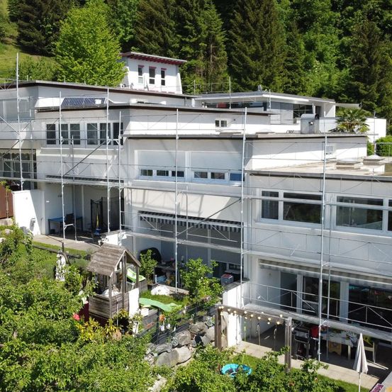 Architecture, Building, Office Building, Outdoors, Plant, Vegetation, Urban, Housing, City, Person