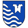 Ein blauer Schild mit einer weißen Wellenlinie und einem weißen Buchstaben W in der Mitte.