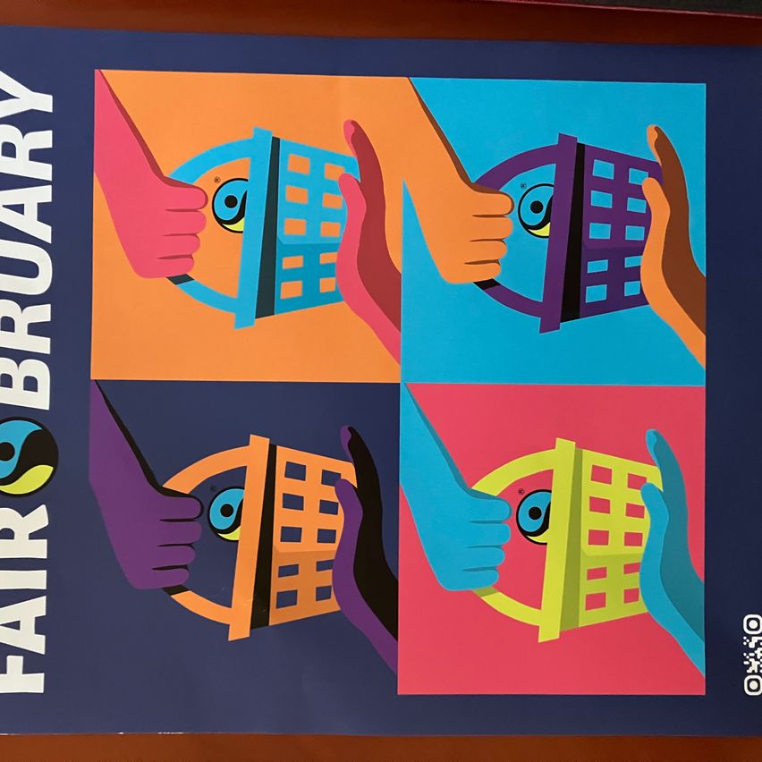 A blue and orange graphic poster titled 'FAIR BRUARY' with hands holding buildings and eyes. The left side has blue buildings, the right side has yellow buildings.